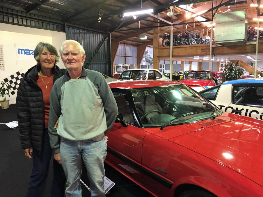 Memories: Vicki and Rob Thompson from Western Australia with Vicki's favourite red car at the National Automobile Museum. Picture: Lucy Stone