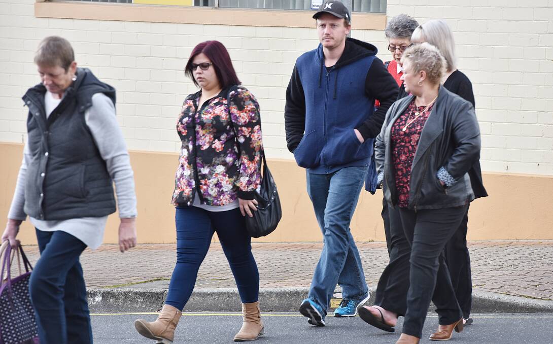 STILL WAITING: Connections of three miners who died at the Mt Lyell mine  approach the Burnie Magistrates Court. Picture: Brodie Weeding. 