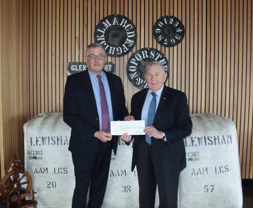 FINAL INSTALLMENT: Minister for Infrastructure Rene Hidding hands over a cheque to Woolmers Estate Chairman Peter Rae. Picture: Stefan Boscia