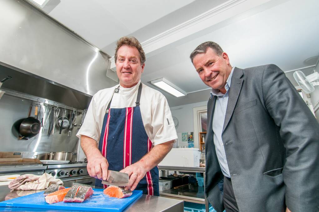 PAY IT FOWARD: Brisbane St Bistro head chef Terry Fidler and City Mission CEO Stephen Brown preparing for the evening. Picture: Phillip Biggs