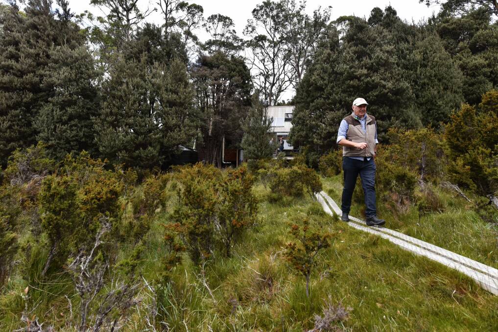 WINNER: Tasmanian Walking Company co-owner Rob Sherrard at his company's luxury Mount Pelion Hut. Picture: Scott Gelston