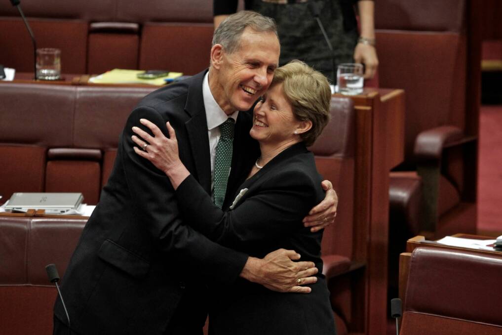 VICTORY: Former Greens leader Bob Brown and Christine Milne celebrate the Clean Energy Act passing through the Senate. Picture: Andrew Meares