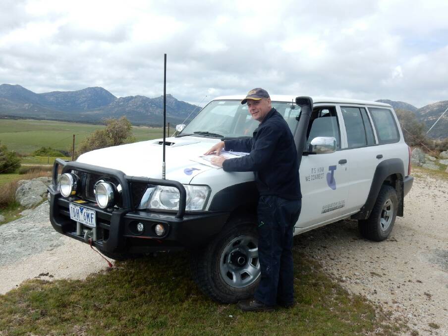 UPGRADES: Telstra design engineer Paul Smrcka surveying Flinders Island. The telecommunications upgrade is an $11 million project. Picture: Supplied