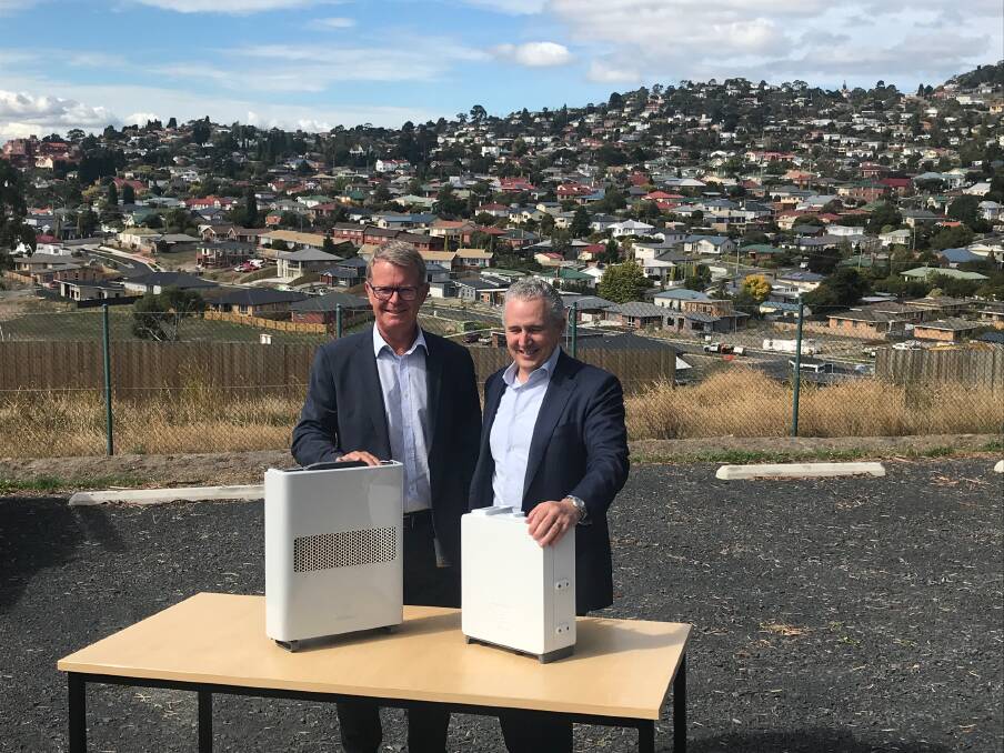 4G: TasNetworks chief executive Lance Balcombe and Telstra chief executive Andy Penn pose with Telstra's small cell technology. Picture: Supplied