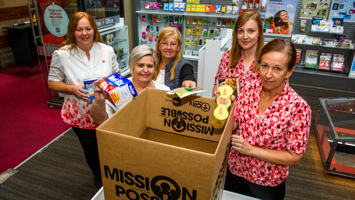 POST OFFICE PRIDE: Australia Post Launceston employees Natalie Hampton, Jusy West, Suzanne Lee, Tania Robertson and Alana Lefevre get ready to share the word about Mission Possible. Picture Scott Gelston 