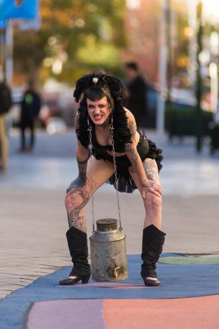PLENTY OF VARIETY: Princess Tweedle Needle, whose real name is Sabina, of Berlin, performs a trick in the Brisbane Street mall, Launceston. Picture: Phillip Biggs