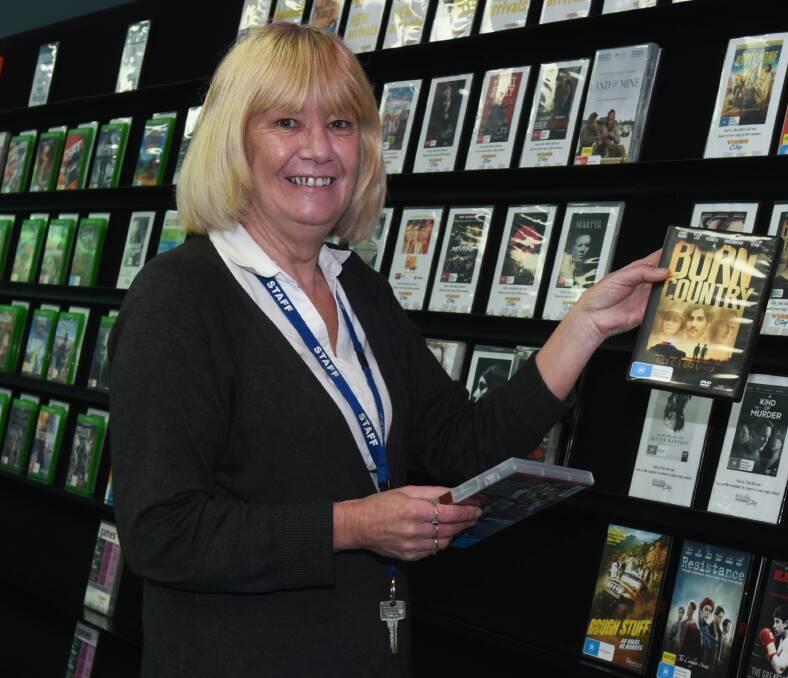 SHELF LIFE: Judith Allen at Launceston's Video City. The video industry has gone through a raft of changes in the past few years. Picture: Neil Richardson.