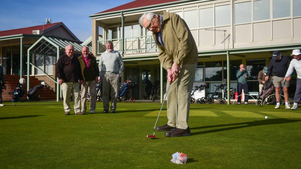 MONEY SHOT: Life member of the Launceston veterans golfers, Eddie Kerfoot, putts while his fellow golfers look on. Picture: Paul Scambler.