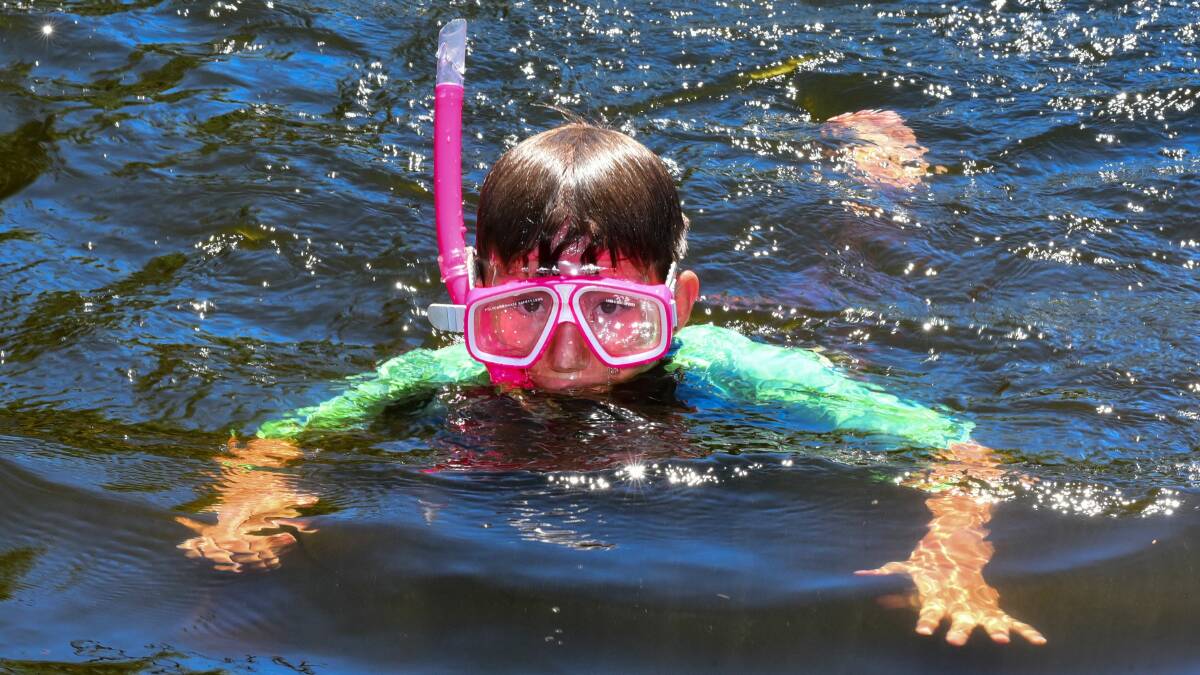 SUMMER FUN: Blake Enright cools off with a dip in the Meander. Picture: Neil Richardson