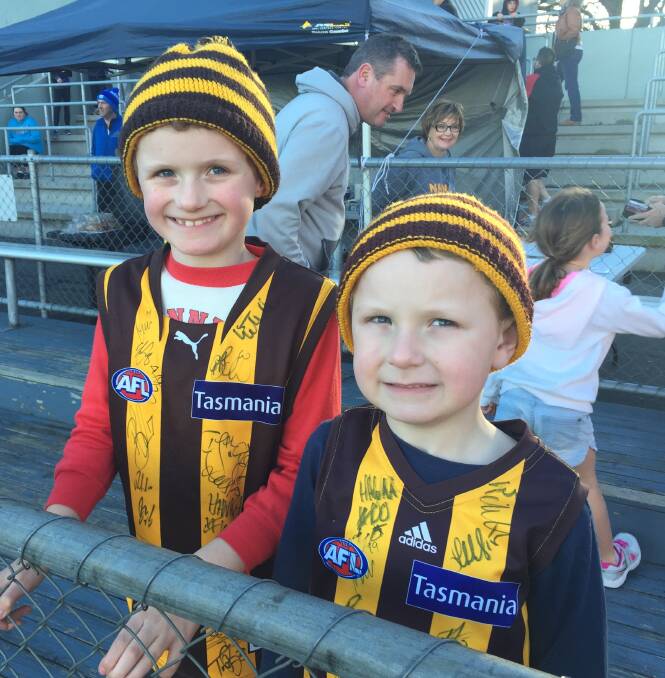 STRONG SUPPORT: Hawthorn supporter Charlotte (7) and Jake (5) Adams at UTAS Stadium on Saturday.