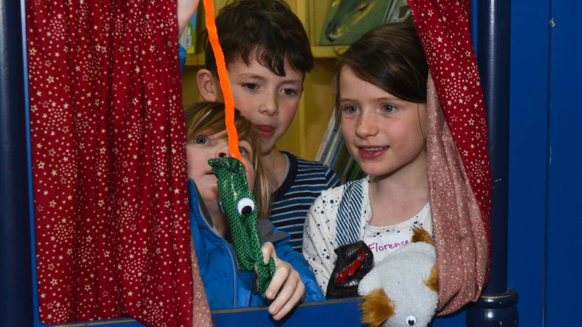 PUPPET POWER: Rupert Rogers, 5, Finn McManamy, 7, and Florence Rupert, 7, perform with their puppets. Picture: Neil Richardson