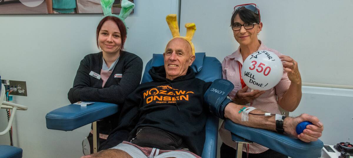 LEGEND: Launceston's John Fawcett, pictured with Sophie Lethborg and Belinda Eyers, donated blood for the 350th time last week. Picture: Neil Richardson 