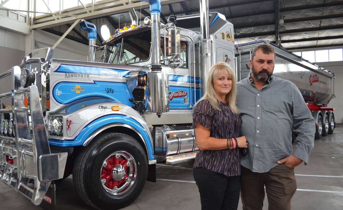 PROUD: Kim and Chris Walters, with the Kentworth T900 Legend number 16 truck that will serve as a rolling memorial for their son Isaac, who died last year. Picture: Jessica Willard 