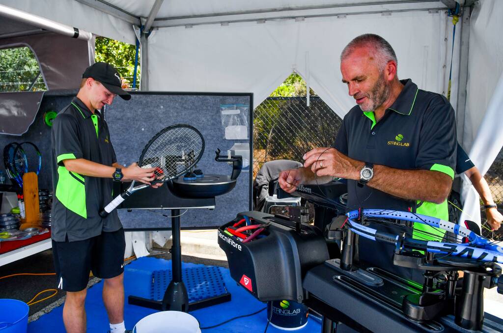 SKILLS: Racquet stringers Jeremy Reeve and Stewart Allwright, are being kept busy at this year's Launceston International. Picture: Scott Gelston. 