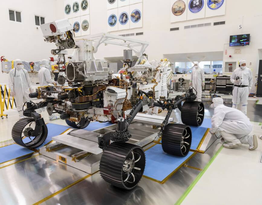NASA scientists work on Mars rover Perseverance in a clean room. Picture: NASA