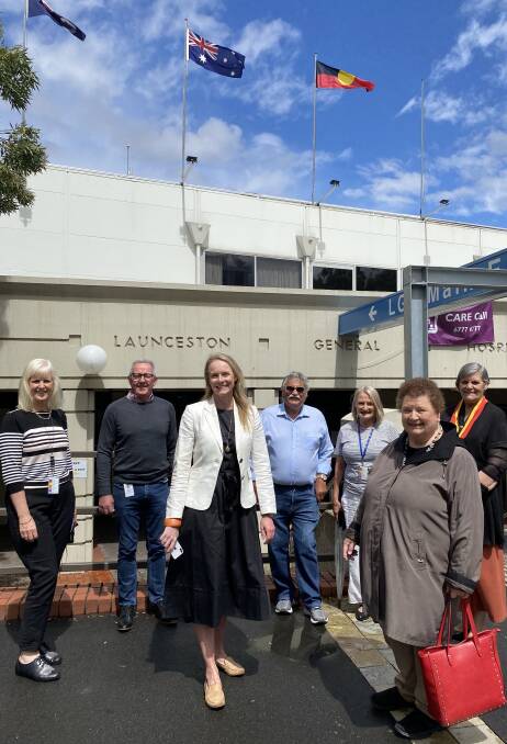 FLAGS RAISED: Fiona Young, Peter O Sullivan, Health Minister Sarah Courtney, Clyde Mansell, Gretchen Long, Nola Hooper and Lola Greeno. Picture: Supplied 