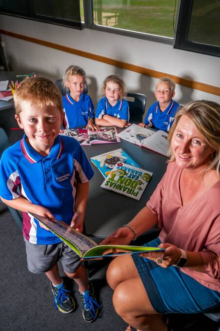 Punchbowl Primary School principal Elizabeth O'Donahue with students Tayte Seen (front, then back left to right) Charlotte Weks, Ivy Mabin and Harry Taylor. 