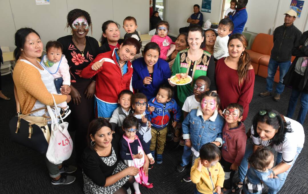 Migrant Resource Centre North’s multicultural playgroup celebrate at a food sharing event on Monday. 