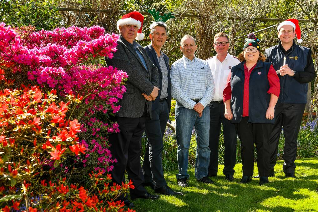 SUPPORT: Launceston Benevolent Society's Don Jones, City Mission's John Clements, St Vincent de Paul's Mark Gaetani, Salvation Army's Kevin Lumb and Anita Reeve, with Carols by Candlelight's Danny Gibson. Picture: Scott Gelston