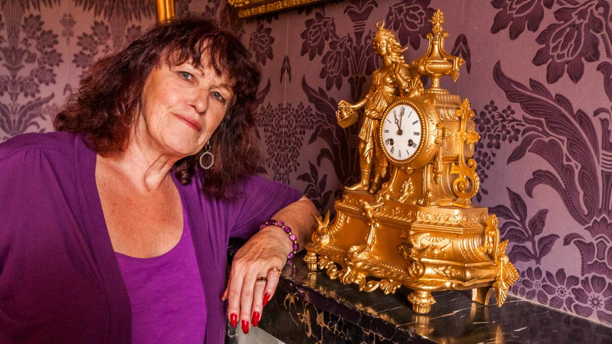 HISTORIC: Clarendon House volunteer Jennie Staal, with one of the 19th century clocks that will benefit from Saturday's fundraiser. Picture: Phillip Biggs 