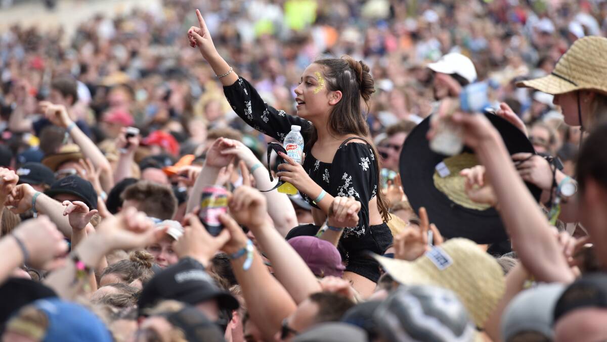 HIGH-RISK SPACE: A punter enjoys the music from someone's shoulders at the Marion Bay leg of the Falls Festival this year. Picture: Brodie Weeding