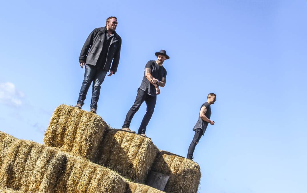 ON TOP OF THE WORLD: Wolfe Brothers Tom and Nick Wolfe and Brodie Rainbird have a new album out, Country Heart. Picture: Lara Hay