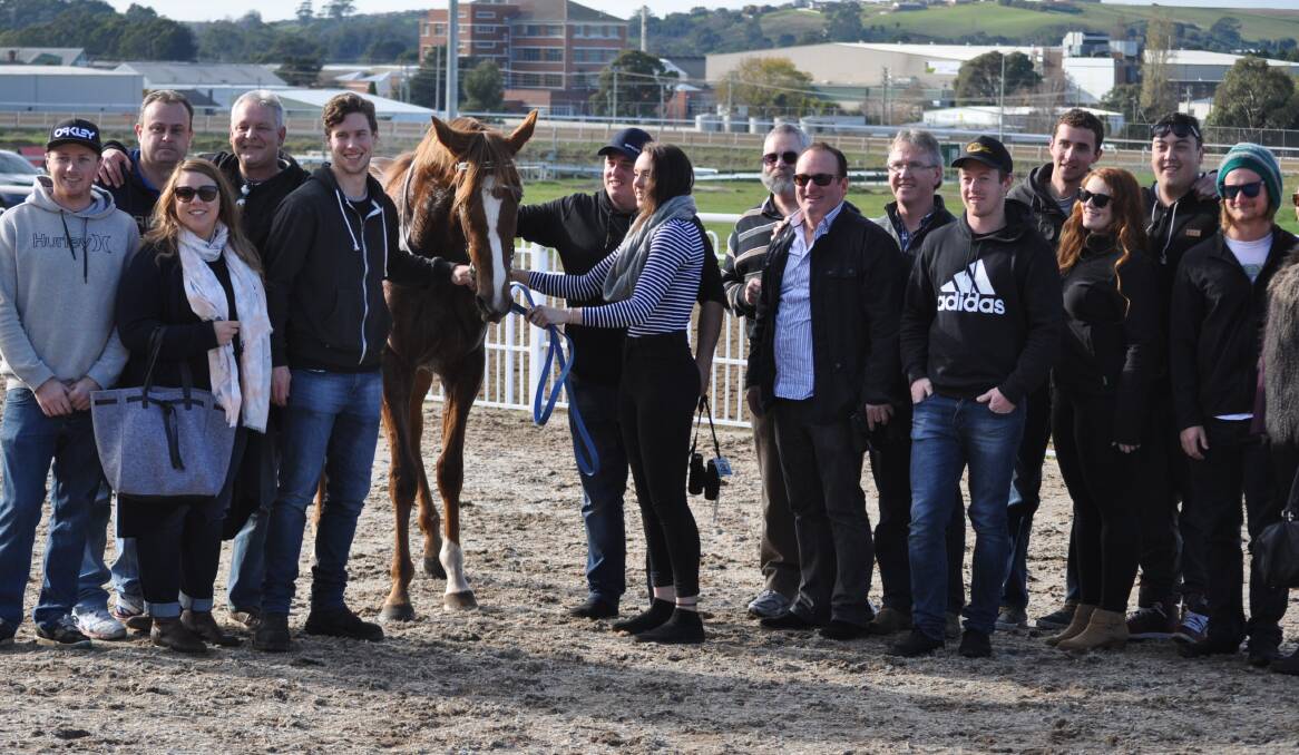 POPULAR: Smart mare Life On The Wire is sure to have plenty of support when she resumes from a spell at Mowbray on Wednesday night. She is pictured with some of her many owners after a win at Spreyton.