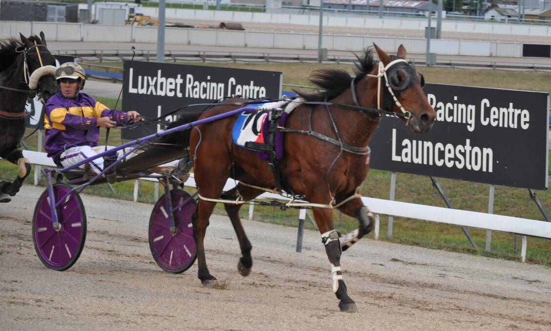 ROCK SOLID: Solid As A Rock, driven by Rohan Hillier, wins the $10,000 NTLHA Cup final at Mowbray on Sunday night. Picture: Greg Mansfield