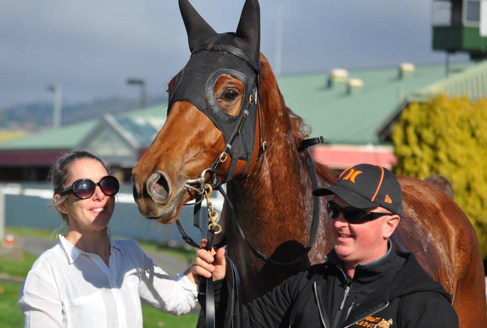 REPAID: Laughing Heir with injured jockey Shiralee Maher and strapper Adrian Duggan after his win at Mowbray on Sunday. Picture: Greg Mansfield