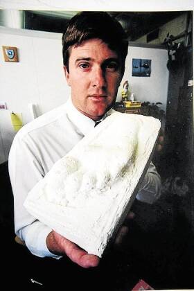 COPY PIC OF EXAMINER PIC.31/1/96 by Craig SherriffDetective Constable Ashley Rushton holds the palster cast of what is believed to be the killer's footprint.