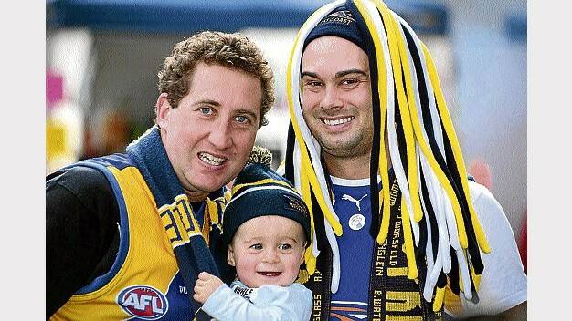 Scott Reid, of Prospect, with one-year-old Lachlan and Dan Crawford, of Legana.