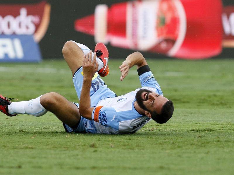 Alex Brosque of Sydney FC is fouled against Central Coast in the A-League.