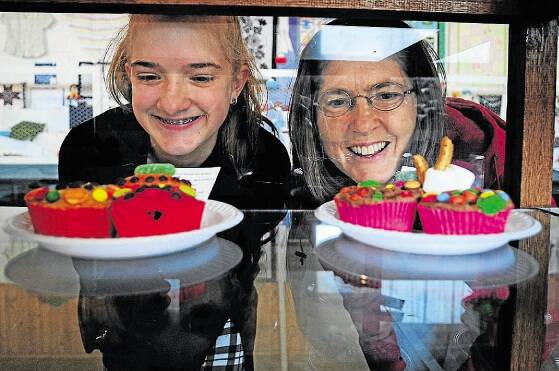 Austyn Skierka and her mother Traci, both of Scottsdale, admire the cakes at the Scottsdale Show. Picture: Peter Sanders.