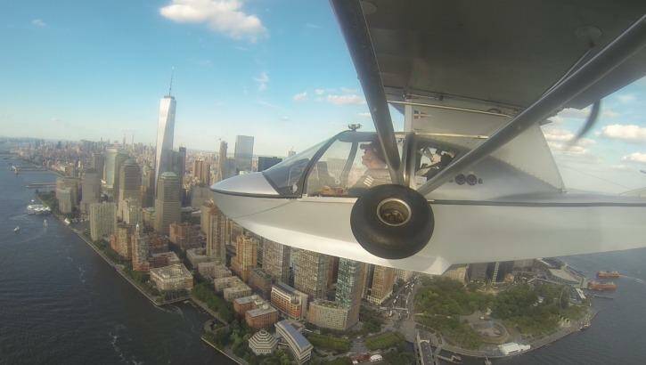 Michael Smith prepares to land his seaplane on the Hudson River in New York.