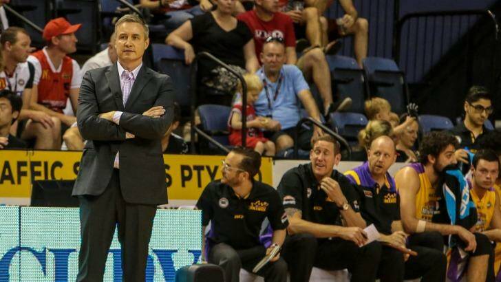 Loss in Wollongong: Damian Cotter looks bemused during the Sydney Kings' loss to Illawarra. His replacement, Joe Connelly, is seated on the bench in between fellow assistant coach Ben Knight and centre Julian Khazzouh. Photo: Adam McLean