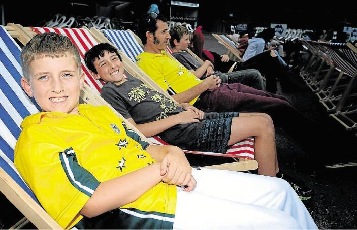 At the World Cup Cricket screening at Civic Square are Eli Moroney, 9, Isaac Moroney, 11, and Patrick Moroney, of Launceston.Picture: GEOFF ROBSON