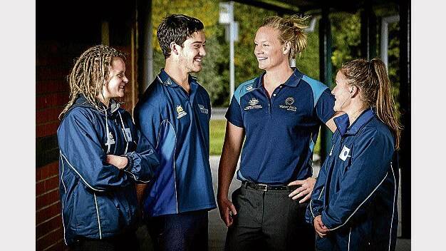 Australian Olympic water polo bronze medallist Rowena Webster (second from right) talks with TIS hockey trio Madeleine Murphey, Benji Austin and Madeleine Hinton at the elite athlete performance induction at Newstead College yesterday. Picture: PHILLIP BIGGS