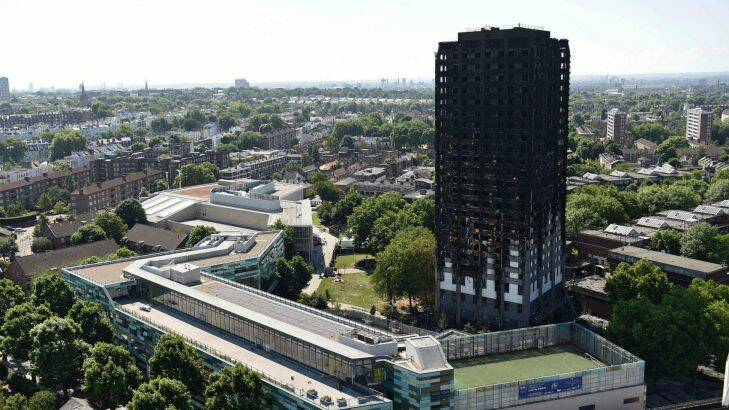 Grenfell Tower in west London after a fire engulfed the 24-storey building on Wednesday morning, Saturday, June 17, 2017. Public fury over the London high-rise fire is mounting as exhausted London firefighters continue their grim search Saturday for victims of the inferno that killed at least 30 people. (David Mirzoeff/PA via AP)