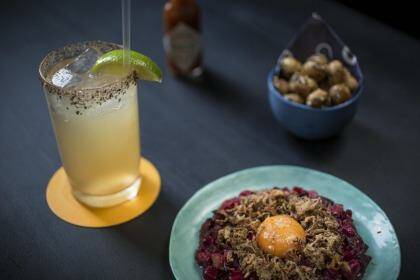 Batanga! cocktail with pickled tartare and macadamias with lemon myrtle dukkah at PS Soda. Photo: Dominic Lorrimer