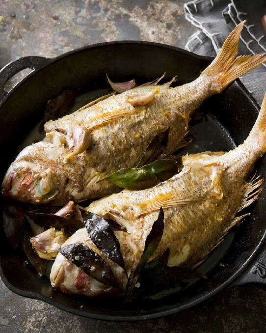 Karen Martini's pan-roasted snapper with garlic and bay leaves <a href="http://www.goodfood.com.au/good-food/cook/recipe/panroasted-snapper-with-garlic-and-bay-leaves-20140114-30roi.html"><b>(recipe here).</b></a> Photo: Marcel Aucar
