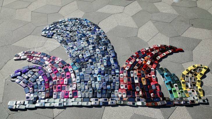 At UTS, a representation of the Sydney Opera House utilises 460 old mobile phones destined for recycling.  Photo: Nic Walker