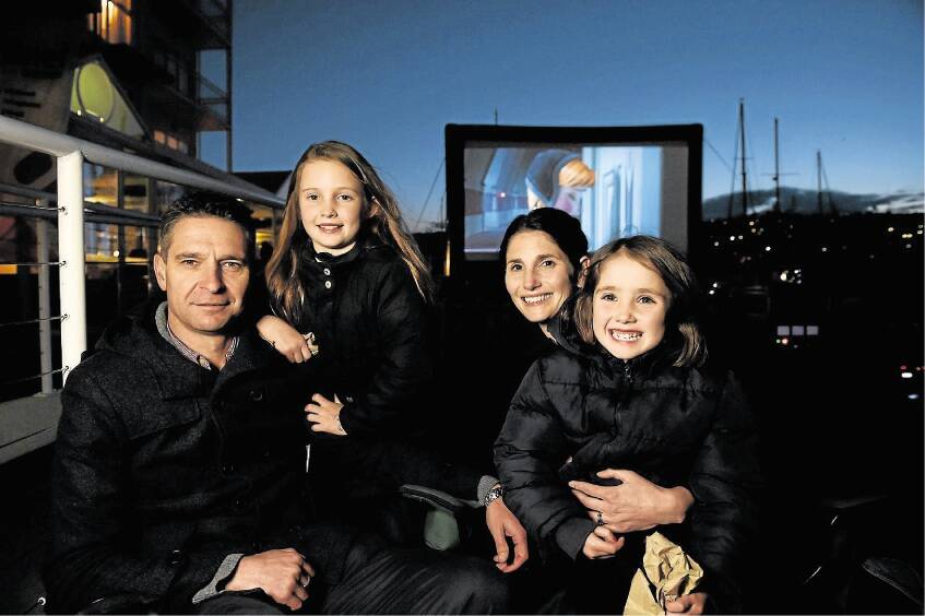 Launceston's Smith family - dad Ray, Aili, 9, mum Jacinta, and Nieve, 6 - at last night's Sundown Cinema screening of Frozen. Picture: MARK JESSER