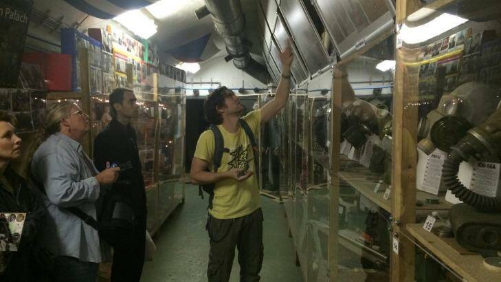 THE WAY IT WAS: Tour guide Ondra explains photographs, in Prague underground nuclear bunker. Photo: Ross Peake 