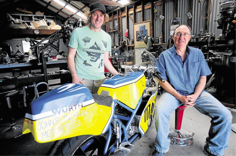 Nathan Greene and his father Mike, of Riverside's B-Spoke Design with the replica 1970s racer they built from photos in a British historic racing magazine. Picture: Peter Sanders.