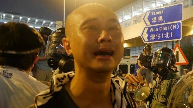 30-year-old postgraduate student Leung Hei is overcome with emotion. Photo: Philip Wen