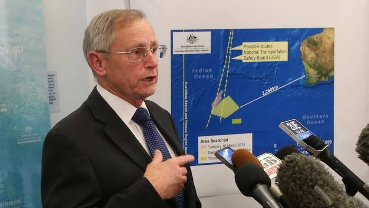 Debris found: Australian Maritime Safety Authority general manager John Young announcing details of what had been spotted. Photo: Andrew Meares