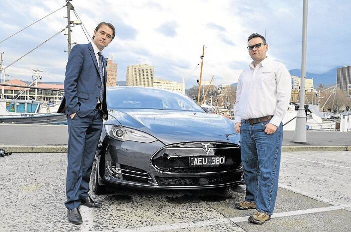 Labor finance spokesman Scott Bacon and motoring journalist Matt Brogan with the Tesla Model S.