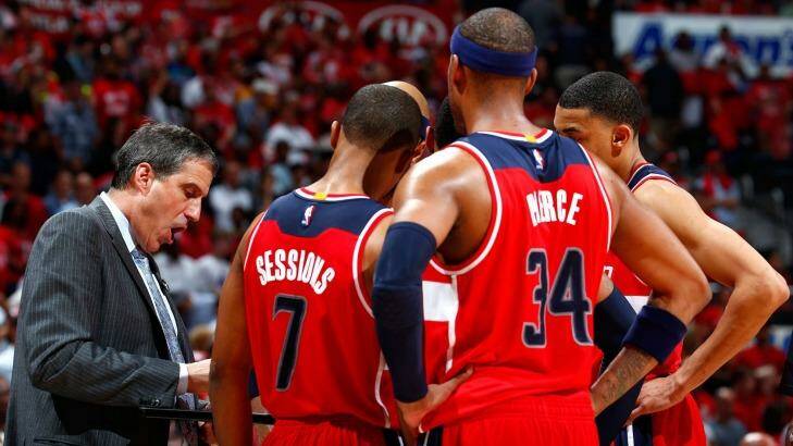 Barking instructions: Randy Wittman huddles his players during a timeout against the Atlanta Hawks. Photo: Kevin C. Cox