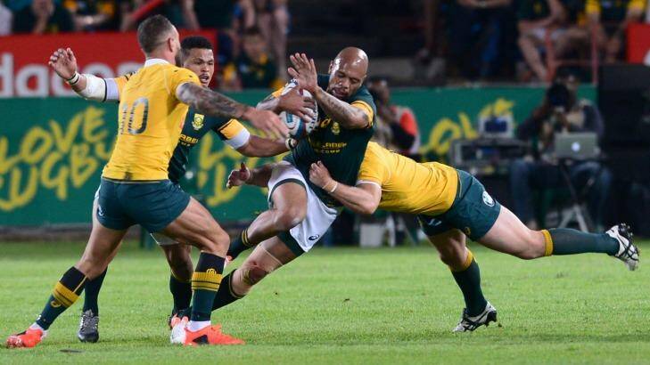 Bernard Foley tackles Lionel Mapoe during the Wallabies loss. Photo: Gallo Images