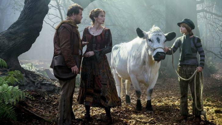 Mysterious quest: The Baker (James Corden) and his wife (Emily Blunt) meet Jack (Daniel Huttlestone) and his cow, Milky Way, in <i>Into the Woods</i>, opening in January.